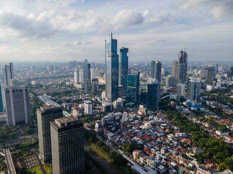 South Jakarta Indonesia 10 January 2026 Aerial view of the modern skyline with towering skyscrapers and dense urban residential areas under a cloudy sky. South Jakarta Indonesia 10 January 2026 Aerial view of the modern skyline with towering skyscrapers and dense urban residential areas under a cloudy sky.