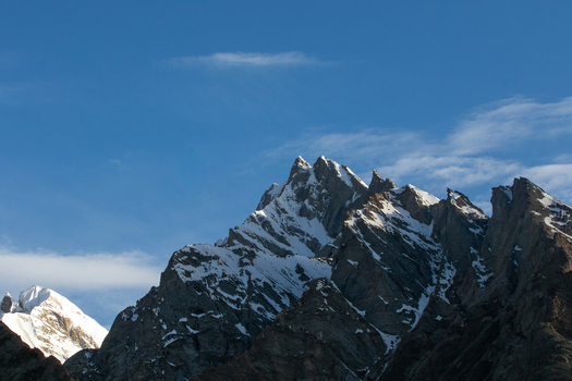View of K2 Base Camp featuring rugged snow capped mountain peaks under a clear blue sky Gilgit Pakistan. View of K2 Base Camp featuring rugged snow capped mountain peaks under a clear blue sky Gilgit Pakistan.