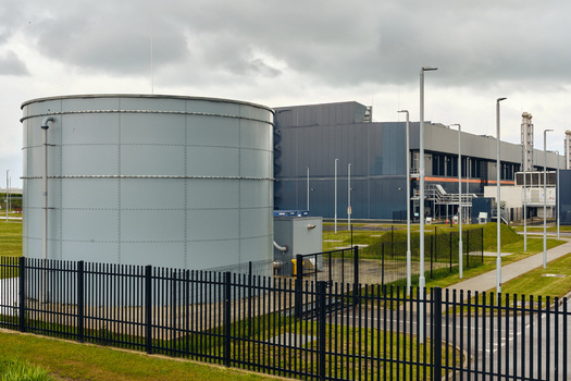 Middenmeer Netherlands 17 May 2026 View of the Microsoft datacenters on Agriport featuring a large storage tank and modern industrial facilities under a cloudy sky.