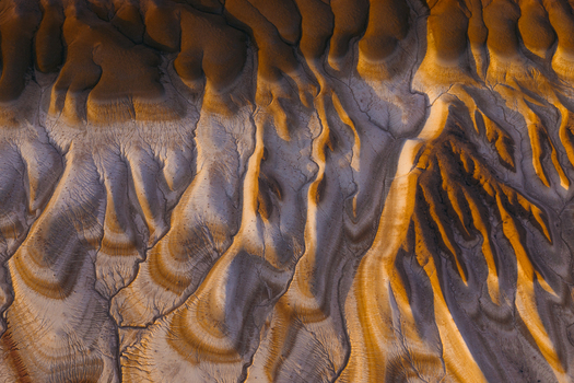 Aerial view of unique geological formations with eroded clay hills and deep ridges in the Mangystau Region Kazakhstan. Aerial view of unique geological formations with eroded clay hills and deep ridges in the Mangystau Region Kazakhstan.