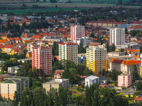 Aerial view of colorful residential apartment blocks and houses surrounded by lush green trees and urban landscape in Hodonin Jihomoravsky kraj Czechia. Aerial view of colorful residential apartment blocks and houses surrounded by lush green trees and urban landscape in Hodonin Jihomoravsky kraj Czechia.