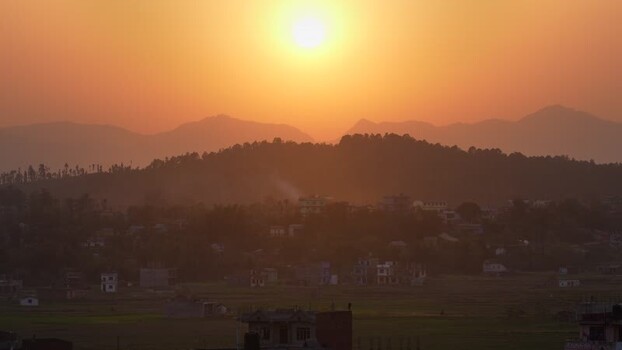 View of the golden sunset over a valley and mountains Nepal
