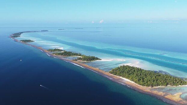 Aerial view of tropical islands and turquoise lagoons Maldives.