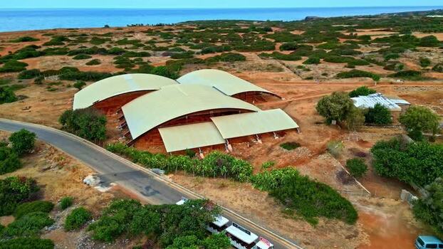 Aerial view of modern building with curved roofs in Crete Greece.