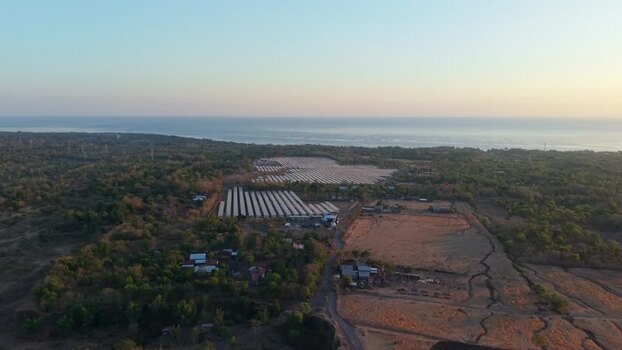 Aerial view of PLTS Bali Timur solar farm in Indonesia. Aerial view of PLTS Bali Timur solar farm in Indonesia.