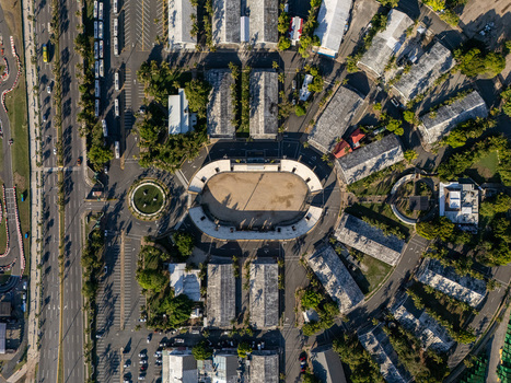 Aerial view of the Feria Ganadera surrounded by parking lots palm trees and urban infrastructure in Santo Domingo Distrito Nacional Dominican Republic. Aerial view of the Feria Ganadera surrounded by parking lots palm trees and urban infrastructure in Santo Domingo Distrito Nacional Dominican Republic.