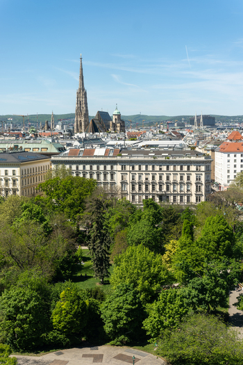 Aerial view of St. Stephen s Cathedral and the historic city skyline with lush green park trees in the foreground in Vienna Vienna Austria. Aerial view of St. Stephen s Cathedral and the historic city skyline with lush green park trees in the foreground in Vienna Vienna Austria.