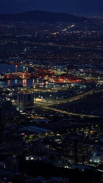 View of Cape Town city lights and harbor at night South Africa. View of Cape Town city lights and harbor at night South Africa.