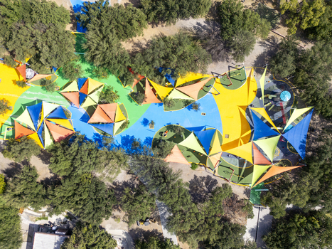 Aerial view of the colorful playground at Fundidora Park and Paseo De La Mujer Park with vibrant shade sails and lush trees in Monterrey Nuevo Leon Mexico. Aerial view of the colorful playground at Fundidora Park and Paseo De La Mujer Park with vibrant shade sails and lush trees in Monterrey Nuevo Leon Mexico.