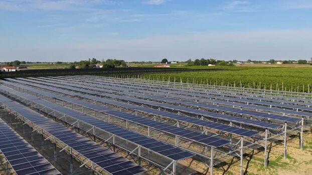 Aerial view of solar panels in a field in Faenza Italy.