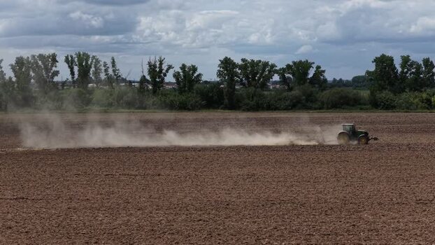 Aerial view of a tractor plowing a field Portugal. Aerial view of a tractor plowing a field Portugal.