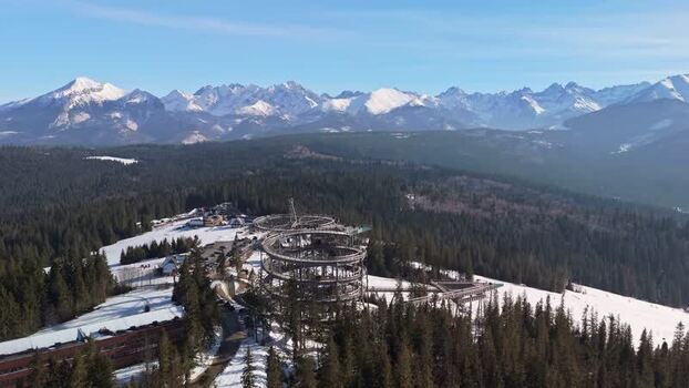 Aerial view of SkyWalk Serce Poronina above snowy Tatra forest in Poland Aerial view of SkyWalk Serce Poronina above snowy Tatra forest in Poland
