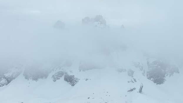 Aerial view of snowy peaks in Parco Naturale Paneveggio Italy.