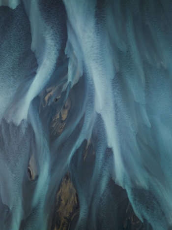 Aerial view of glacial rivers carve intricate patterns across the landscape a symphony of blues and greys contrasting against the dark earth Iceland. Aerial view of glacial rivers carve intricate patterns across the landscape a symphony of blues and greys contrasting against the dark earth Iceland.