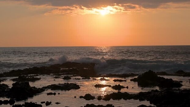 View of a rocky ocean coastline at sunset United States.