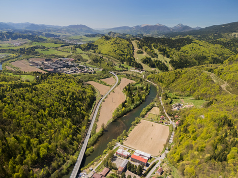 Aerial view of the Orava river winding through lush green hills and forested landscapes near Oravsky Podzamok Zilina Region Slovakia. Aerial view of the Orava river winding through lush green hills and forested landscapes near Oravsky Podzamok Zilina Region Slovakia.