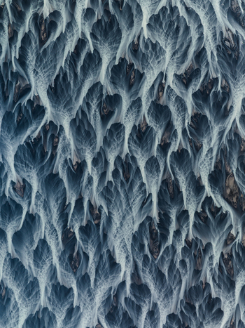 Aerial view of braided glacial rivers carving through the stark landscape creating a tapestry of silver and charcoal that evokes the raw beauty of Iceland Iceland. Aerial view of braided glacial rivers carving through the stark landscape creating a tapestry of silver and charcoal that evokes the raw beauty of Iceland Iceland.