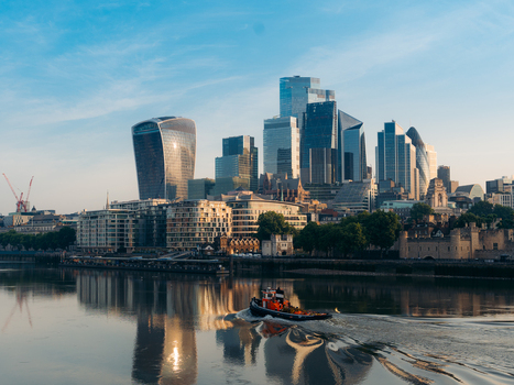 London United Kingdom 20 June 2025 View of the modern skyline reflecting in the Thames with iconic buildings like the Walkie Talkie shimmering under a soft warm light. London United Kingdom 20 June 2025 View of the modern skyline reflecting in the Thames with iconic buildings like the Walkie Talkie shimmering under a soft warm light.
