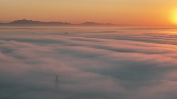 Aerial view of Europa Point lighthouse above clouds Gibraltar.
