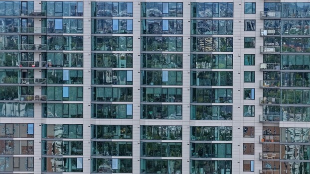 Aerial view of the modern glass facade and balconies of a high rise building in the Cherry Creek district of Denver Colorado United States. Aerial view of the modern glass facade and balconies of a high rise building in the Cherry Creek district of Denver Colorado United States.