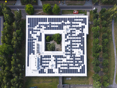 Aerial view of the HTC 33 Design building with a roof covered in solar panels and a central courtyard with trees Eindhoven Noord Brabant Netherlands. Aerial view of the HTC 33 Design building with a roof covered in solar panels and a central courtyard with trees Eindhoven Noord Brabant Netherlands.