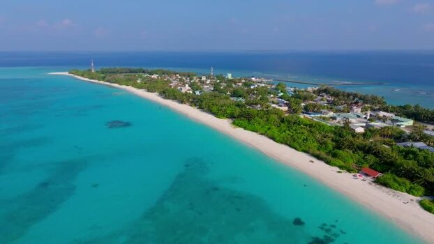 Aerial view of Vashafaru Island with tower Maldives.