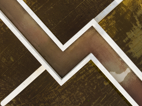 Aerial view of the geometric concrete walls and industrial textures of a water treatment facility in Diepenbeek Flanders Belgium. Aerial view of the geometric concrete walls and industrial textures of a water treatment facility in Diepenbeek Flanders Belgium.