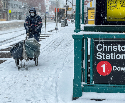 New York United States 14 May 2026 View of a postal worker pushing a mail cart through heavy snow past the Christopher St Station subway entrance in Manhattan. New York United States 14 May 2026 View of a postal worker pushing a mail cart through heavy snow past the Christopher St Station subway entrance in Manhattan.