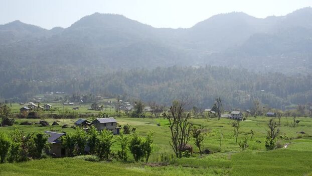 View of rural houses and green fields in the mountains Nepal.