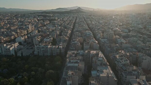 Aerial view of urban rooftops and city streets in Athens Greece.
