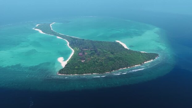Aerial view of Vaikaradhoo island in the Maldives. Aerial view of Vaikaradhoo island in the Maldives.