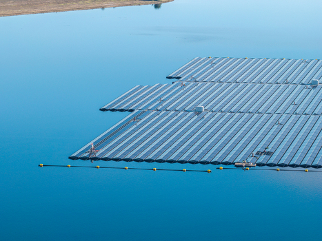Aerial view of the floating solar farm on Cottbuser Ostsee featuring rows of solar panels on the calm blue water surface at the former open pit mine in Cottbus Brandenburg Germany. Aerial view of the floating solar farm on Cottbuser Ostsee featuring rows of solar panels on the calm blue water surface at the former open pit mine in Cottbus Brandenburg Germany.