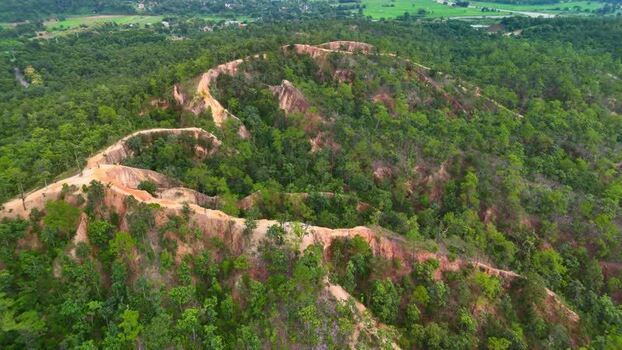 Aerial view of Pai Canyon ridges and lush forest Thailand.
