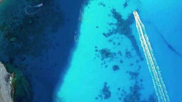 Aerial view of boats in turquoise waters Greece.