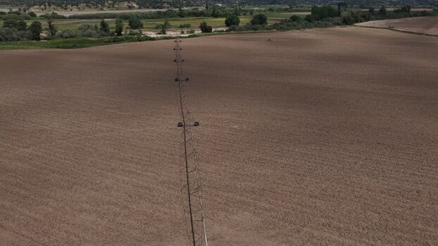 Aerial view of an irrigation system in a plowed field Portugal.