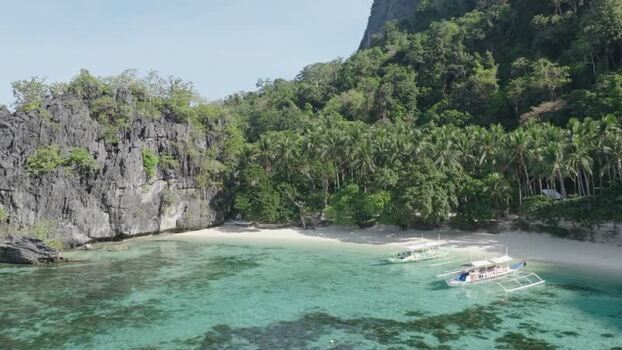 Aerial view of Papaya Beach and boats in El Nido Philippines. Aerial view of Papaya Beach and boats in El Nido Philippines.