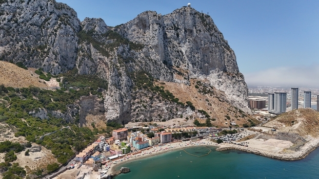 Gibraltar Gibraltar 02 July 2024 Aerial view of the Rock of Gibraltar and the Eastside Project development featuring coastal buildings rocky cliffs and the Mediterranean sea. Gibraltar Gibraltar 02 July 2024 Aerial view of the Rock of Gibraltar and the Eastside Project development featuring coastal buildings rocky cliffs and the Mediterranean sea.