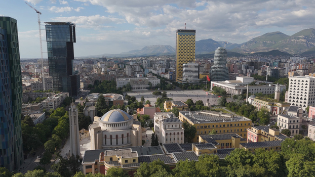 Aerial view of Skanderbeg Square featuring the Orthodox Cathedral of the Resurrection of Christ modern skyscrapers and historic architecture in Tirane Tirana County Albania.