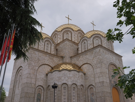 View of the Church of Saints Constantine and Helena with its distinctive golden domes and stone facade under a cloudy sky in Shkupi Qyteti i Shkupit North Macedonia. View of the Church of Saints Constantine and Helena with its distinctive golden domes and stone facade under a cloudy sky in Shkupi Qyteti i Shkupit North Macedonia.