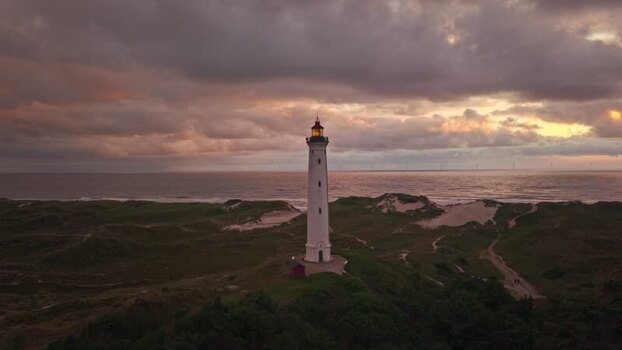 Aerial view of Lyngvig Lighthouse at sunset Denmark.