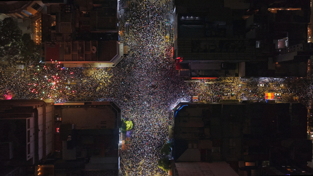 Buenos Aires CABA Argentina 15 July 2026 Aerial view of a massive crowd celebrating at the Cabildo and Juramento intersection in Belgrano at night with city lights. Buenos Aires CABA Argentina 15 July 2026 Aerial view of a massive crowd celebrating at the Cabildo and Juramento intersection in Belgrano at night with city lights.