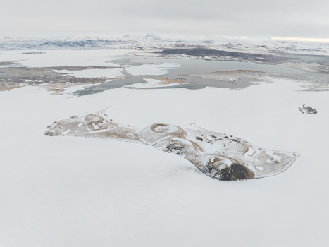 Aerial view of the snow covered volcanic pseudocraters of Skutustadagigar at Lake Myvatn in the winter landscape of THingeyjarsveit Iceland. Aerial view of the snow covered volcanic pseudocraters of Skutustadagigar at Lake Myvatn in the winter landscape of THingeyjarsveit Iceland.