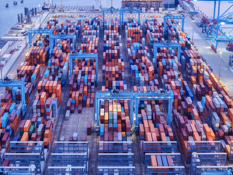 Aerial view of the Vado Ligure container port Italy s first semi automated facility with rows of shipping containers gantry cranes and a storage yard in Vado Ligure Liguria Italy. Aerial view of the Vado Ligure container port Italy s first semi automated facility with rows of shipping containers gantry cranes and a storage yard in Vado Ligure Liguria Italy.