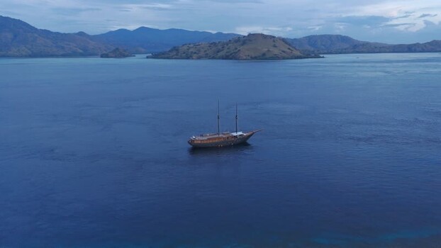 Aerial view of a traditional phinisi boat near Komodo Indonesia.