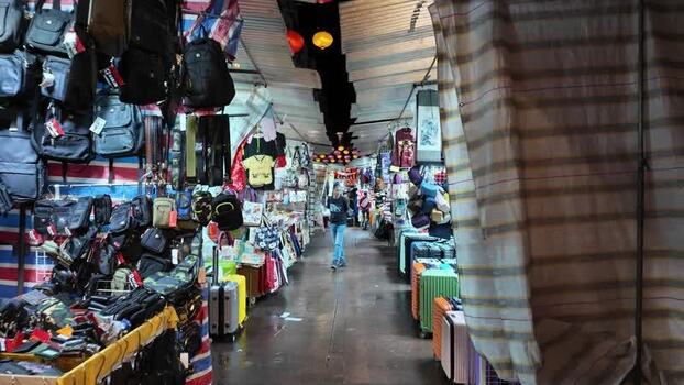 View of a night market with bags and luggage in Hong Kong.