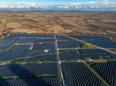 Trino Italy 30 March 2026 Aerial view of a vast solar farm contrasts against the backdrop of snow capped mountains showcasing the blend of technology and nature. Trino Italy 30 March 2026 Aerial view of a vast solar farm contrasts against the backdrop of snow capped mountains showcasing the blend of technology and nature.