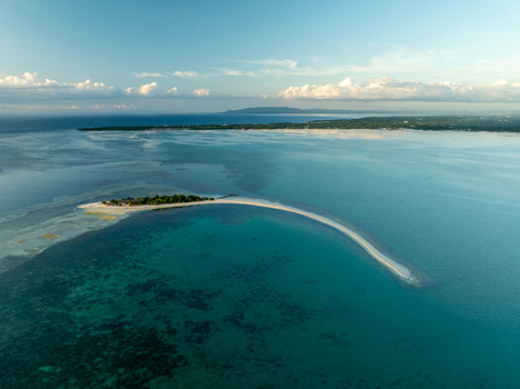 Aerial view of Pungtud sandbank surrounded by turquoise waters and coral reefs in Panglao Philippines. Aerial view of Pungtud sandbank surrounded by turquoise waters and coral reefs in Panglao Philippines.