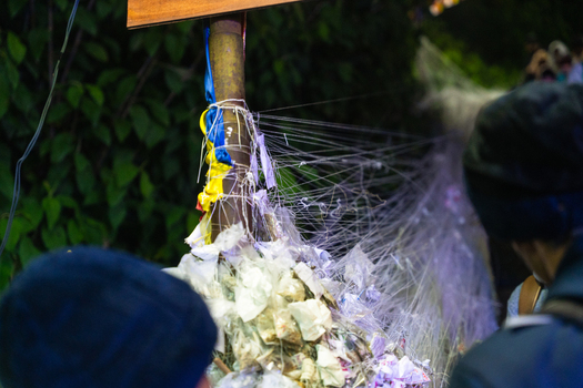 View of white ritual threads tied to a pole by pilgrims on the path to Adam s Peak with lush green foliage in the background Ratnapura Sabaragamuwa Province Sri Lanka. View of white ritual threads tied to a pole by pilgrims on the path to Adam s Peak with lush green foliage in the background Ratnapura Sabaragamuwa Province Sri Lanka.