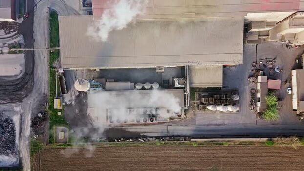 Aerial view of industrial buildings with smoke Serbia.