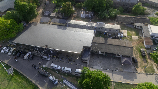 Aerial view of the Wole Soyinka Centre for Culture and Creative Arts National Theatre Nigeria with its large roof and parking lot in Lagos Lagos Nigeria. Aerial view of the Wole Soyinka Centre for Culture and Creative Arts National Theatre Nigeria with its large roof and parking lot in Lagos Lagos Nigeria.